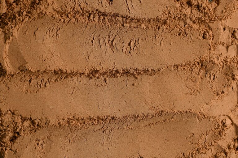 Close-up texture of cocoa powder with ridged patterns and fine granules